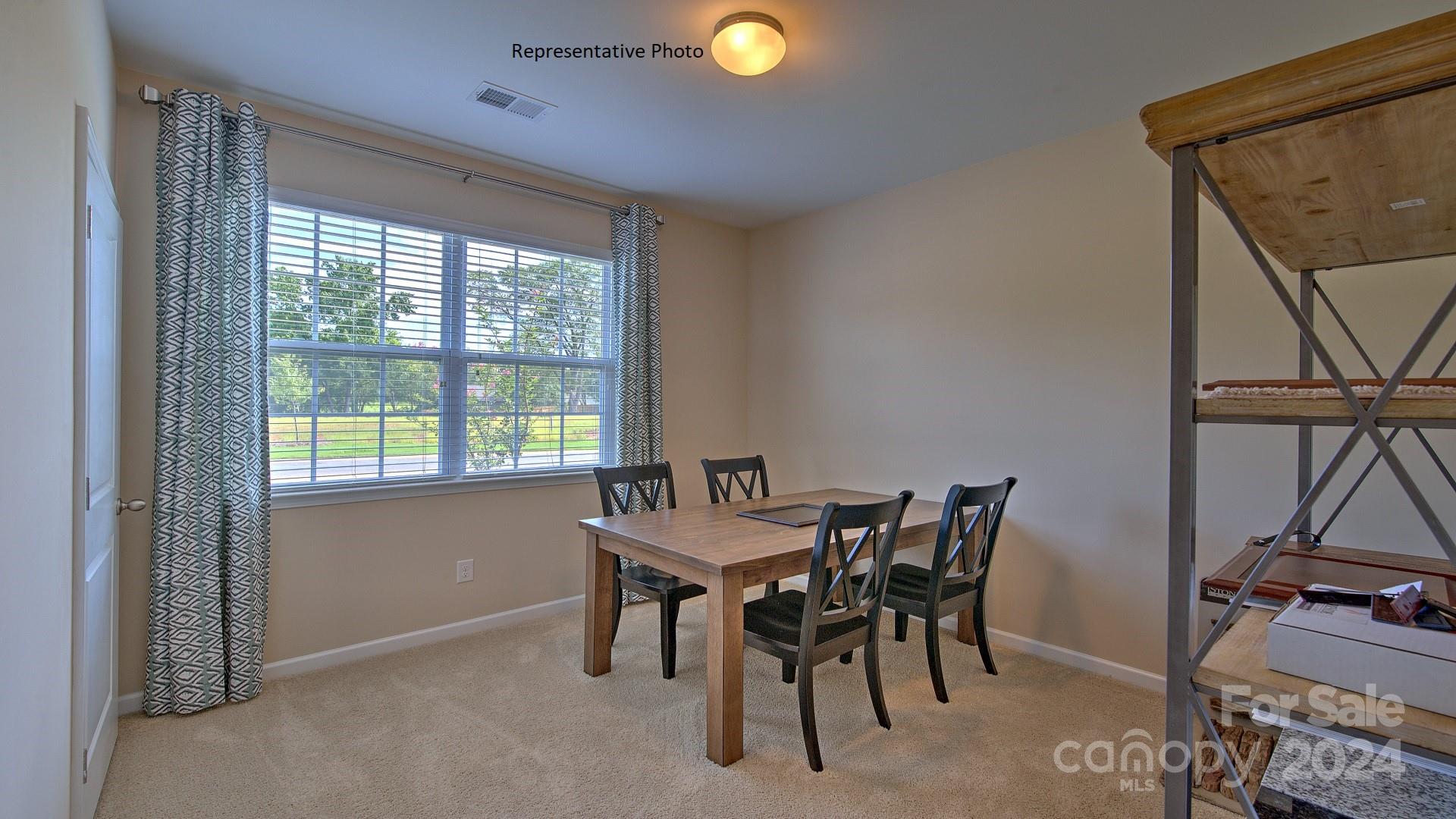 3779 Charles Street Northwest Conover, NC 28613 - Photo 21 of 36 a view of a dining room with furniture and a window