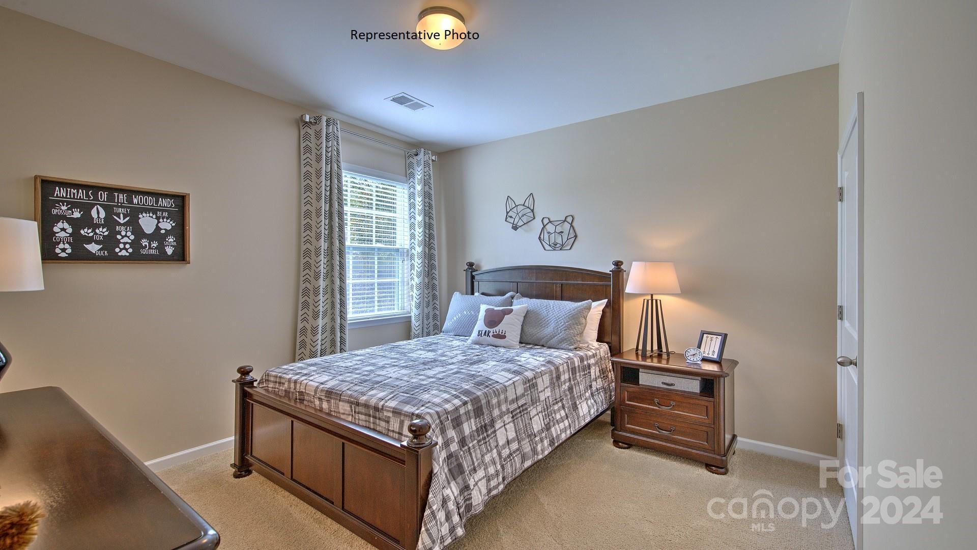 3779 Charles Street Northwest Conover, NC 28613 - Photo 22 of 36 a bedroom with a bed and a window