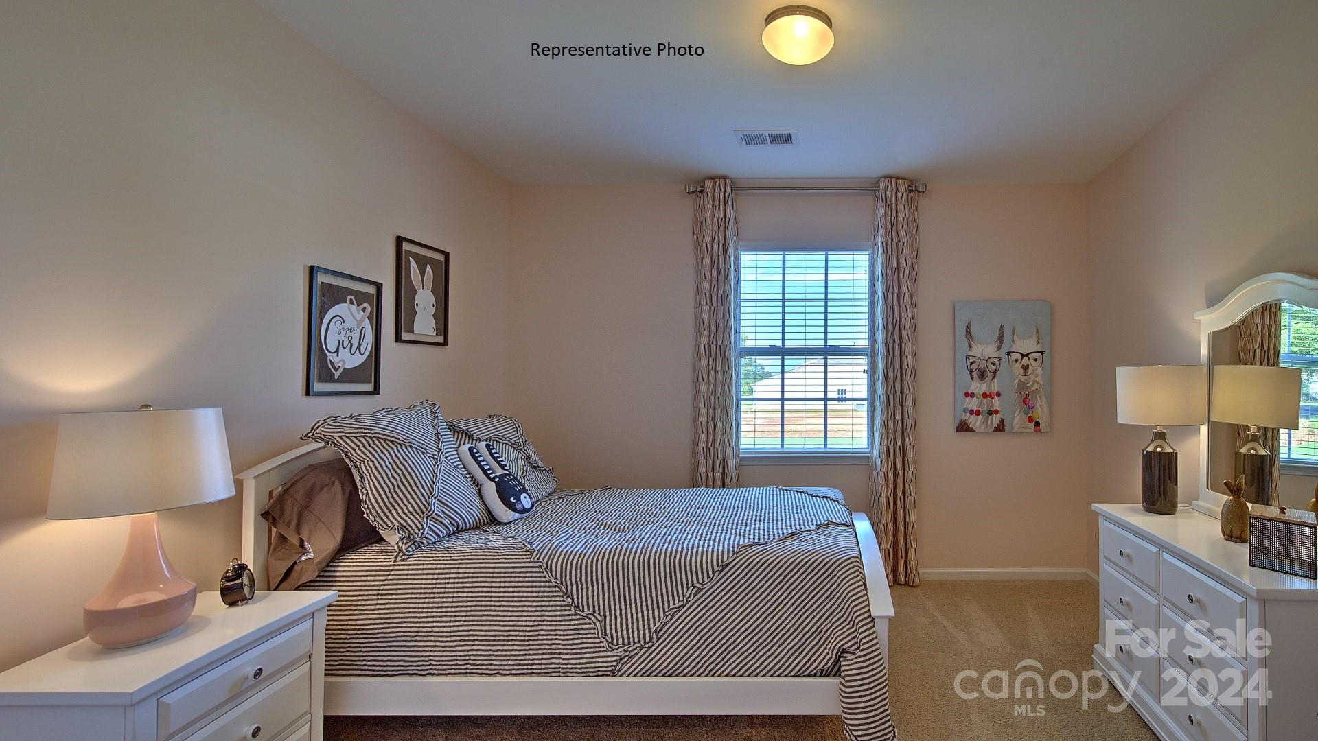 3779 Charles Street Northwest Conover, NC 28613 - Photo 24 of 36 a bedroom with a bed and painting on the wall