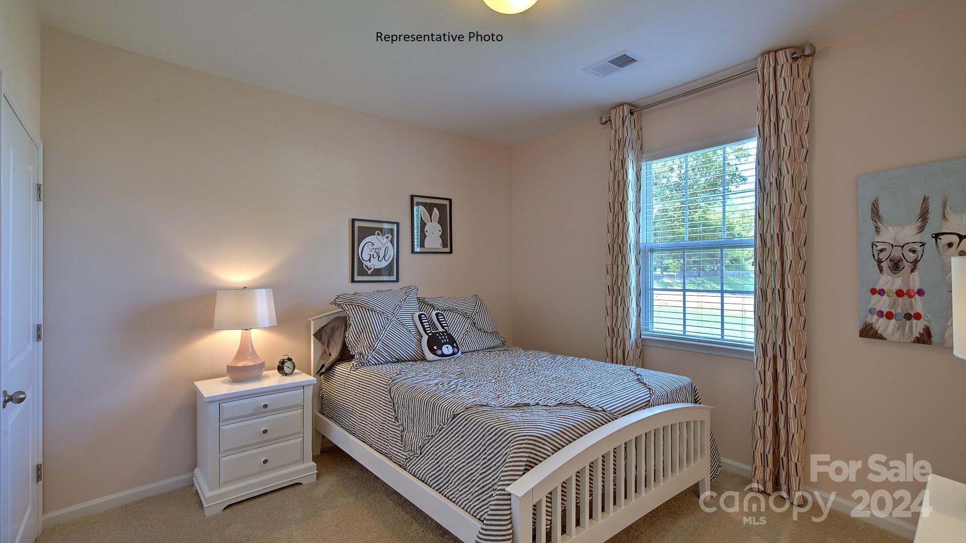 3779 Charles Street Northwest Conover, NC 28613 - Photo 25 of 36 a bedroom with a bed and window