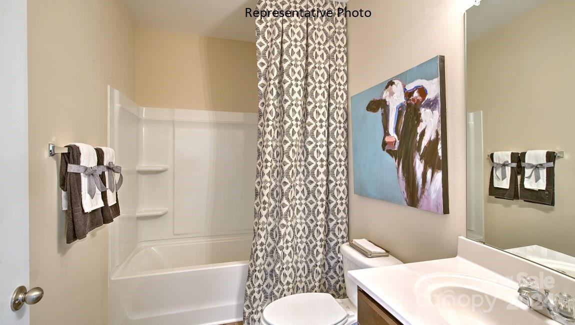 3779 Charles Street Northwest Conover, NC 28613 - Photo 31 of 36 a bathroom with a bathtub and shower
