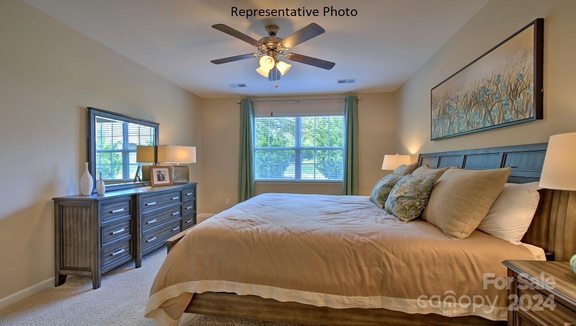 3779 Charles Street Northwest Conover, NC 28613 - Photo 35 of 36 a bedroom with a bed and a dresser