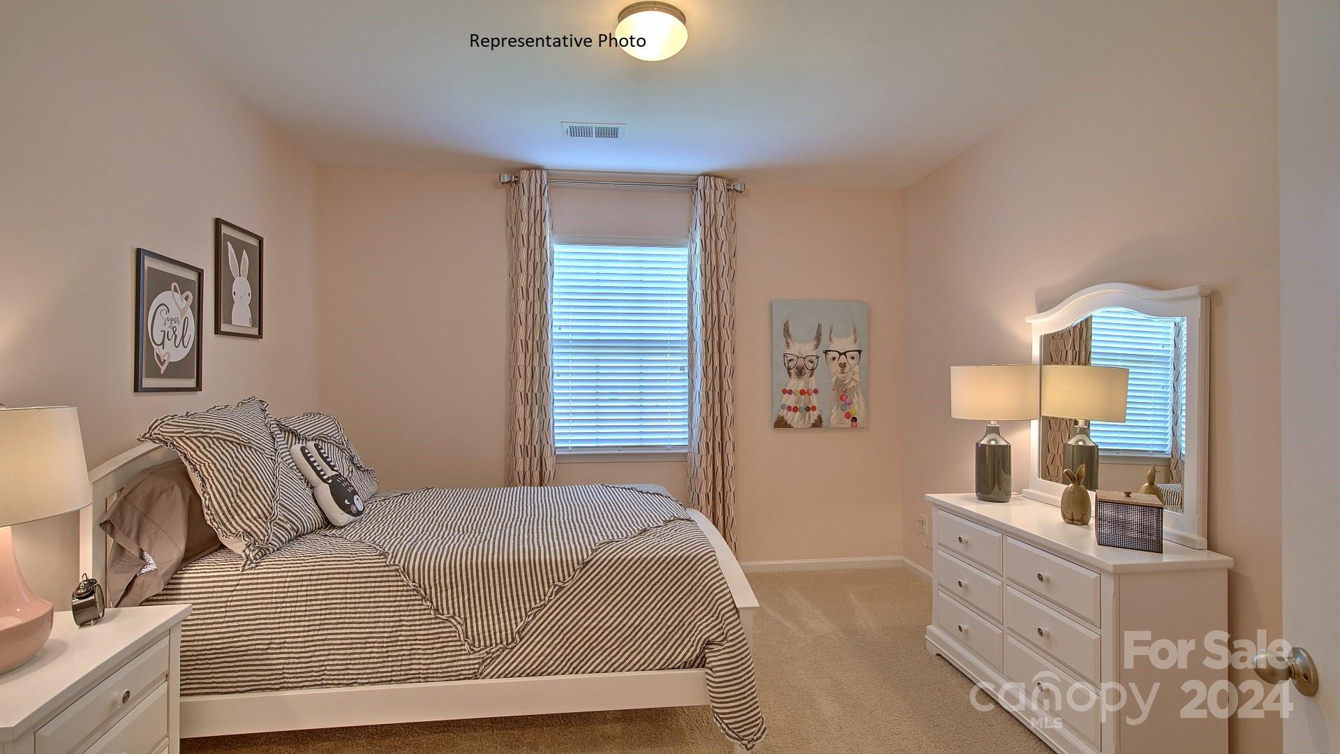 3779 Charles Street Northwest Conover, NC 28613 - Photo 36 of 36 a bedroom with a bed and painting on the wall