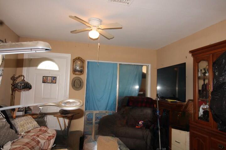 1501 West 11th Street Riviera Beach, FL 33404 - Photo 5 of 10 a living room with furniture and a flat screen tv