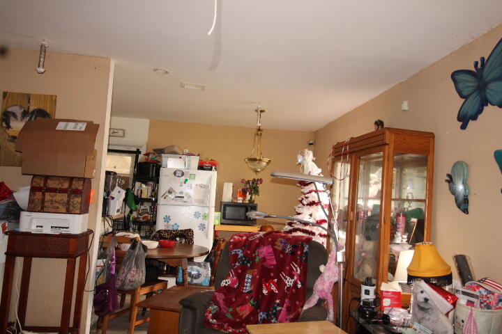 1501 West 11th Street Riviera Beach, FL 33404 - Photo 6 of 10 a bedroom with furniture and a closet