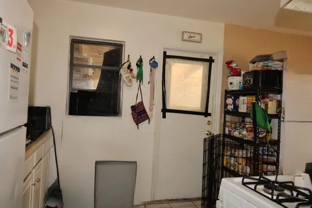 a bathroom with a bathtub and a window