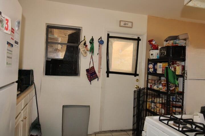1501 West 11th Street Riviera Beach, FL 33404 - Photo 7 of 10 a bathroom with a bathtub and a window
