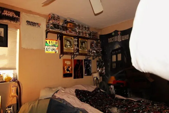 a bedroom with bed and a closet