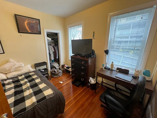 a room with furniture and a flat screen tv