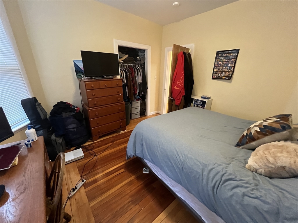 29 Cameron Avenue, Unit 1 Somerville, MA 02144 - Photo 7 of 16 a bedroom with a bed and a flat screen tv