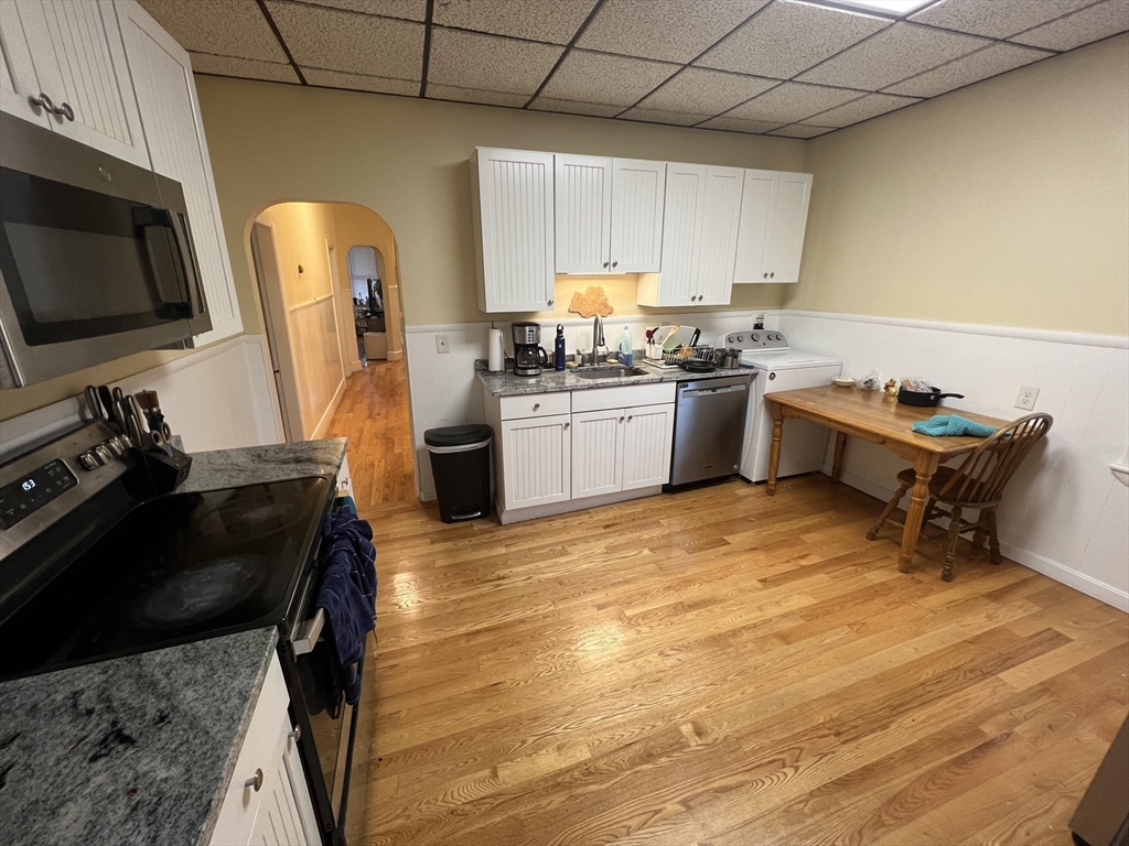 29 Cameron Avenue, Unit 1 Somerville, MA 02144 - Photo 10 of 16 a kitchen with a sink appliances and cabinets