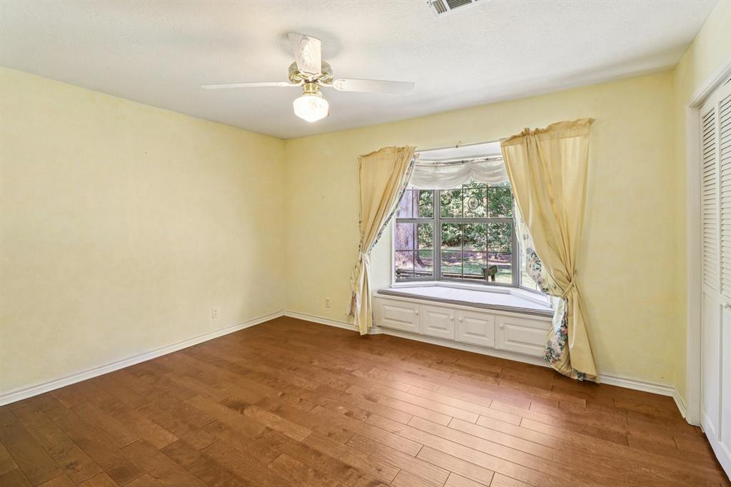 329 Lowell Road Milford, TX 76670 - Photo 15 of 40 a view of room with window and hardwood floor