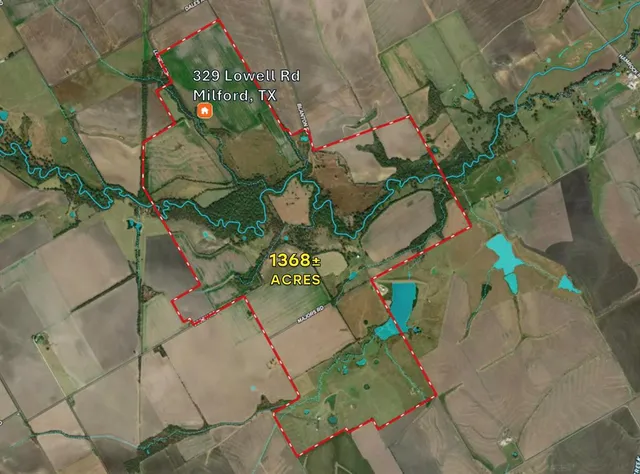 an aerial view of ocean with residential house and outdoor space