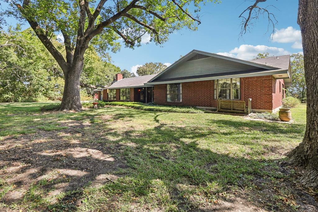 329 Lowell Road Milford, TX 76670 - Photo 3 of 40 a front view of a house with yard