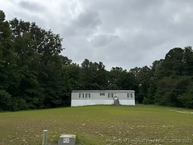 a view of a field with an outdoor space