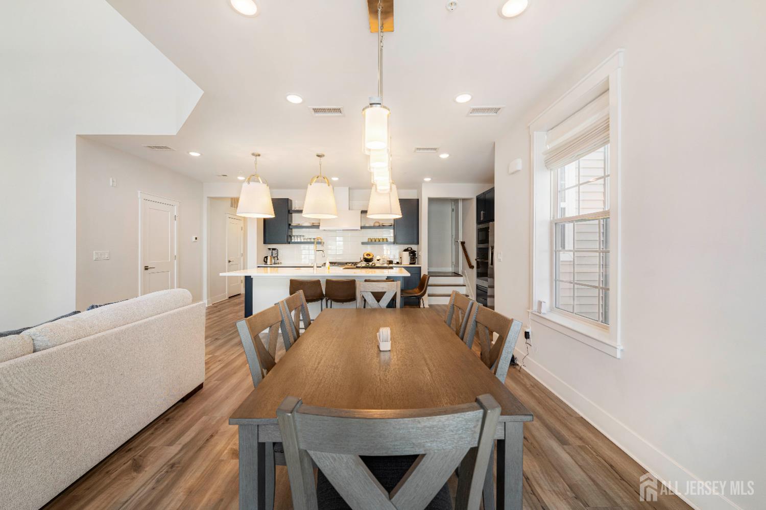 707 Station Road Dunellen, NJ 08812 - Photo 11 of 28 a view of a dining room with furniture window and wooden floor