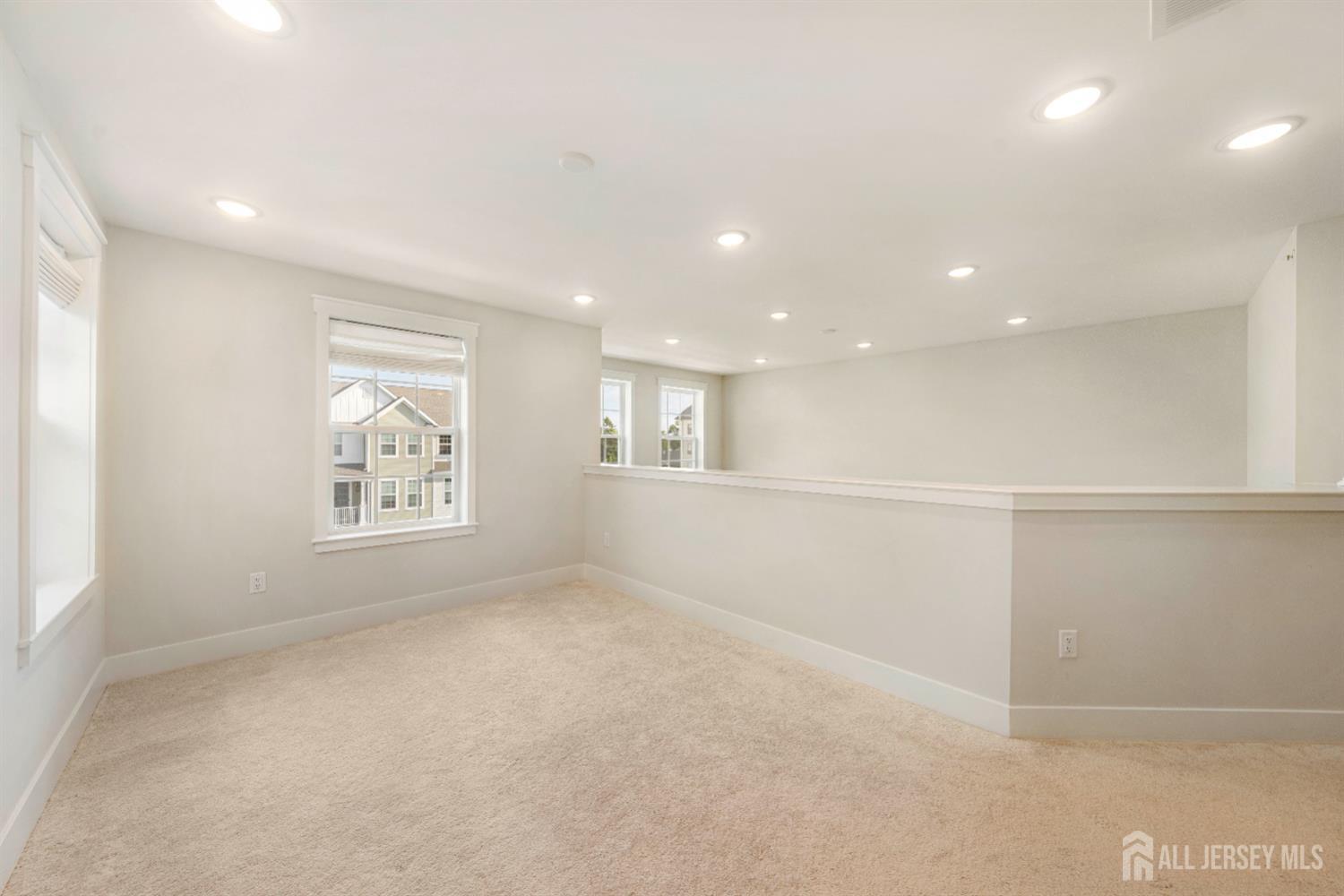 707 Station Road Dunellen, NJ 08812 - Photo 13 of 28 an empty room with windows and closet