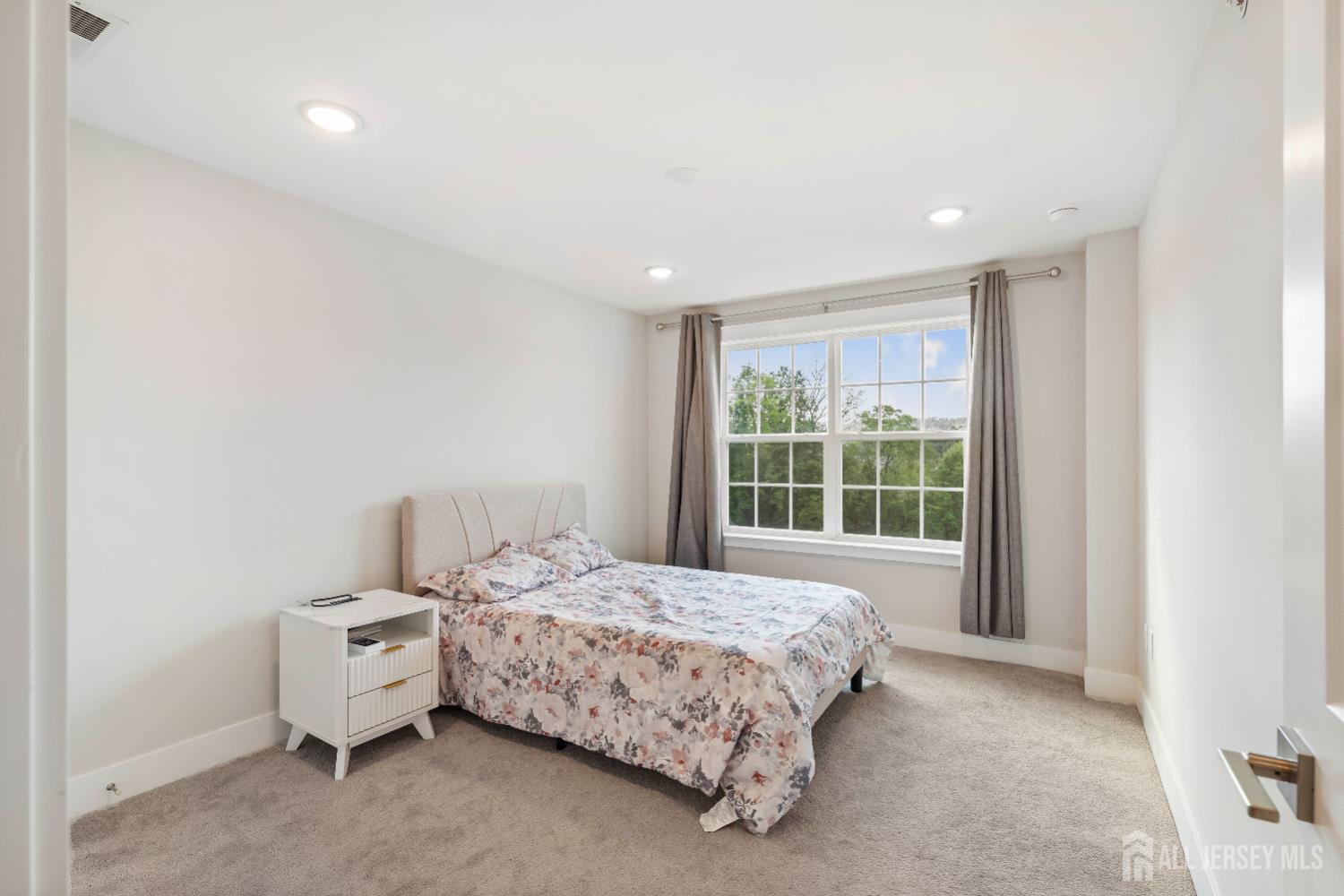 707 Station Road Dunellen, NJ 08812 - Photo 21 of 28 a bedroom with a bed and a window