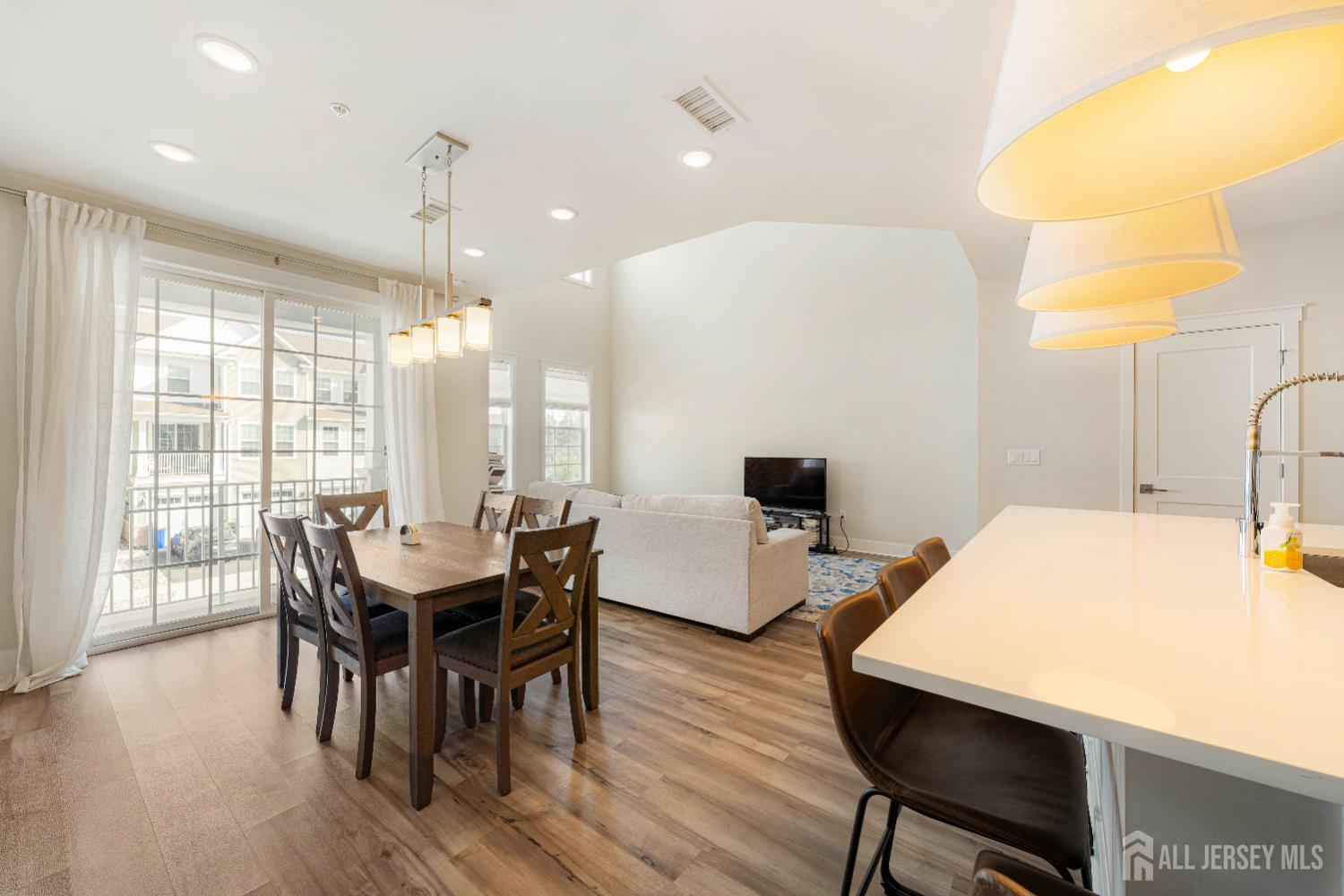 707 Station Road Dunellen, NJ 08812 - Photo 8 of 28 a view of a dining room with furniture and wooden floor
