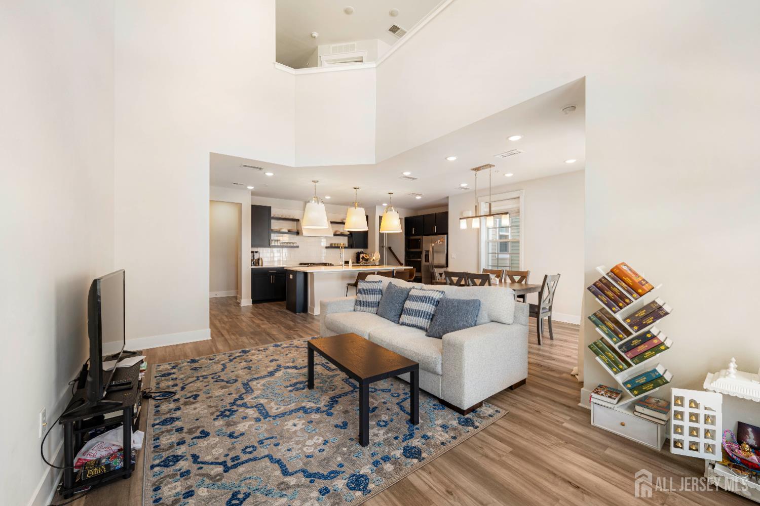 707 Station Road Dunellen, NJ 08812 - Photo 9 of 28 a living room with furniture and a flat screen tv
