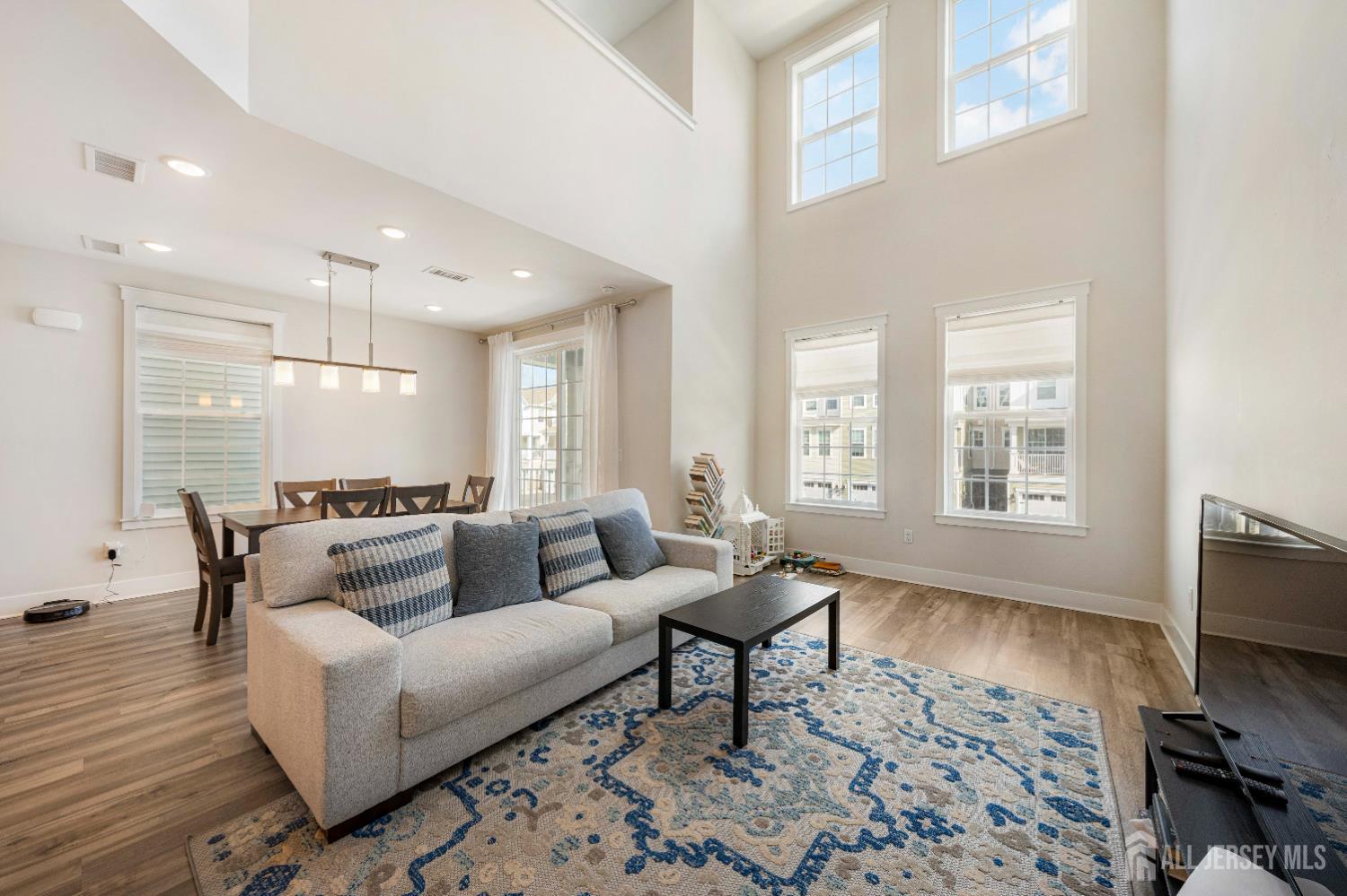 707 Station Road Dunellen, NJ 08812 - Photo 10 of 28 a living room with furniture and a flat screen tv