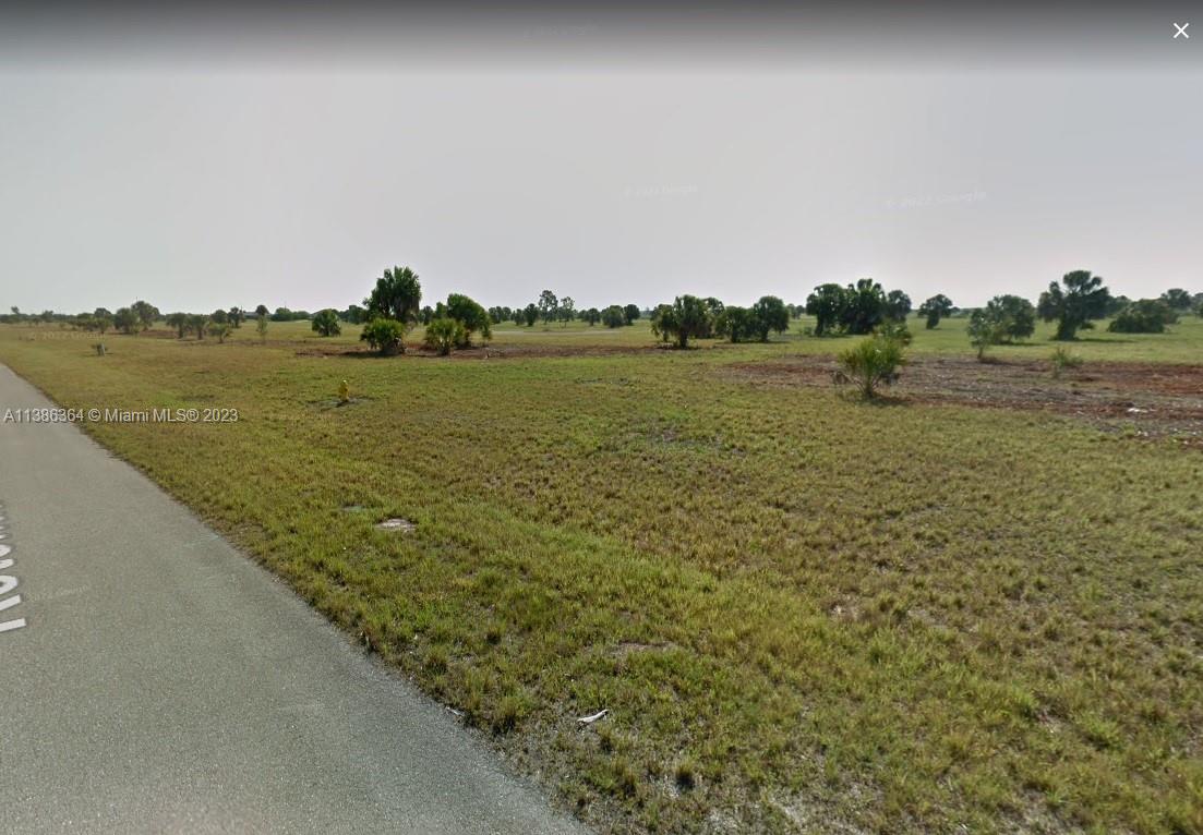 18 Lark Drive Placida, FL 33946 - Photo 3 of 6 a view of a lake from a yard