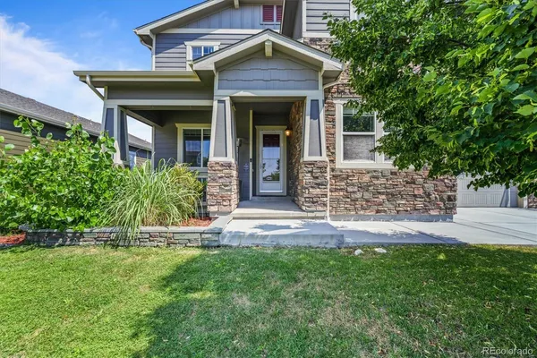 front view of a house with a yard
