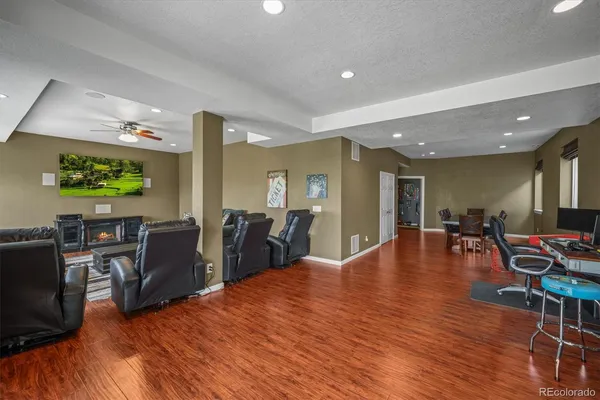 a lobby with furniture and wooden floor