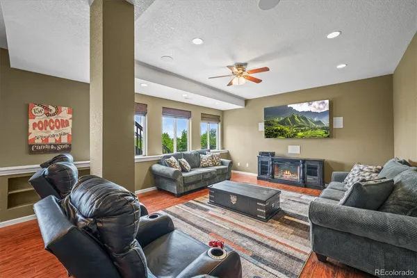a living room with furniture a couch and a flat screen tv