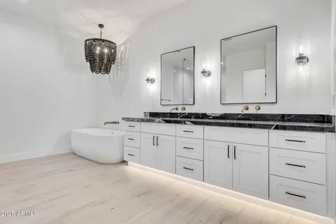 a view of kitchen and kitchen with a sink oven cabinets