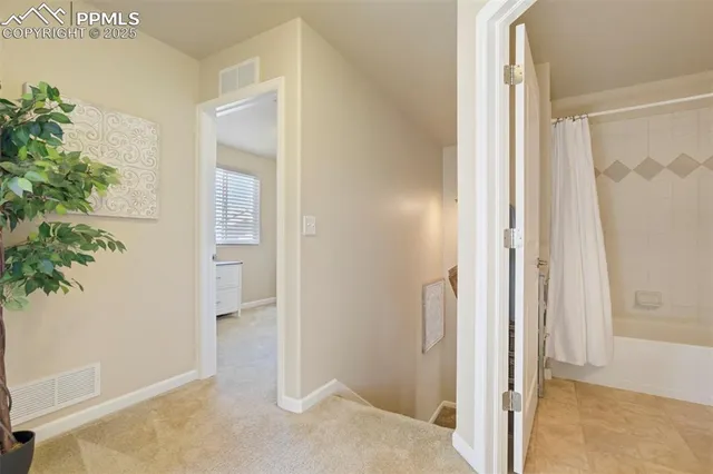 a view of a bedroom from a hallway