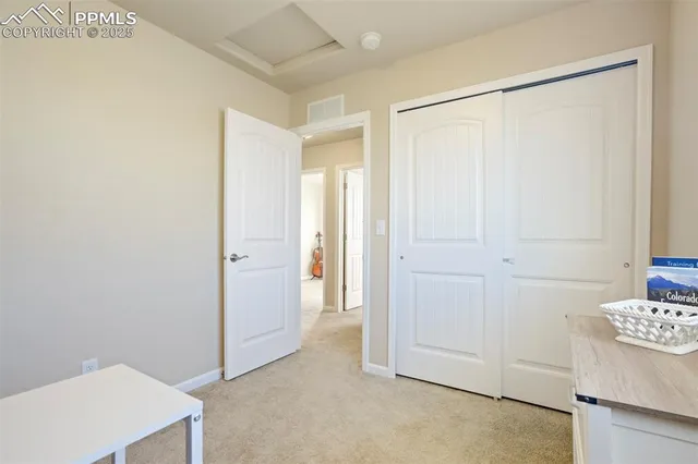 a view of a bedroom with closet