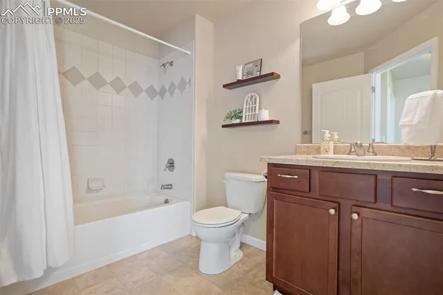 a kitchen with a sink a counter space and a refrigerator
