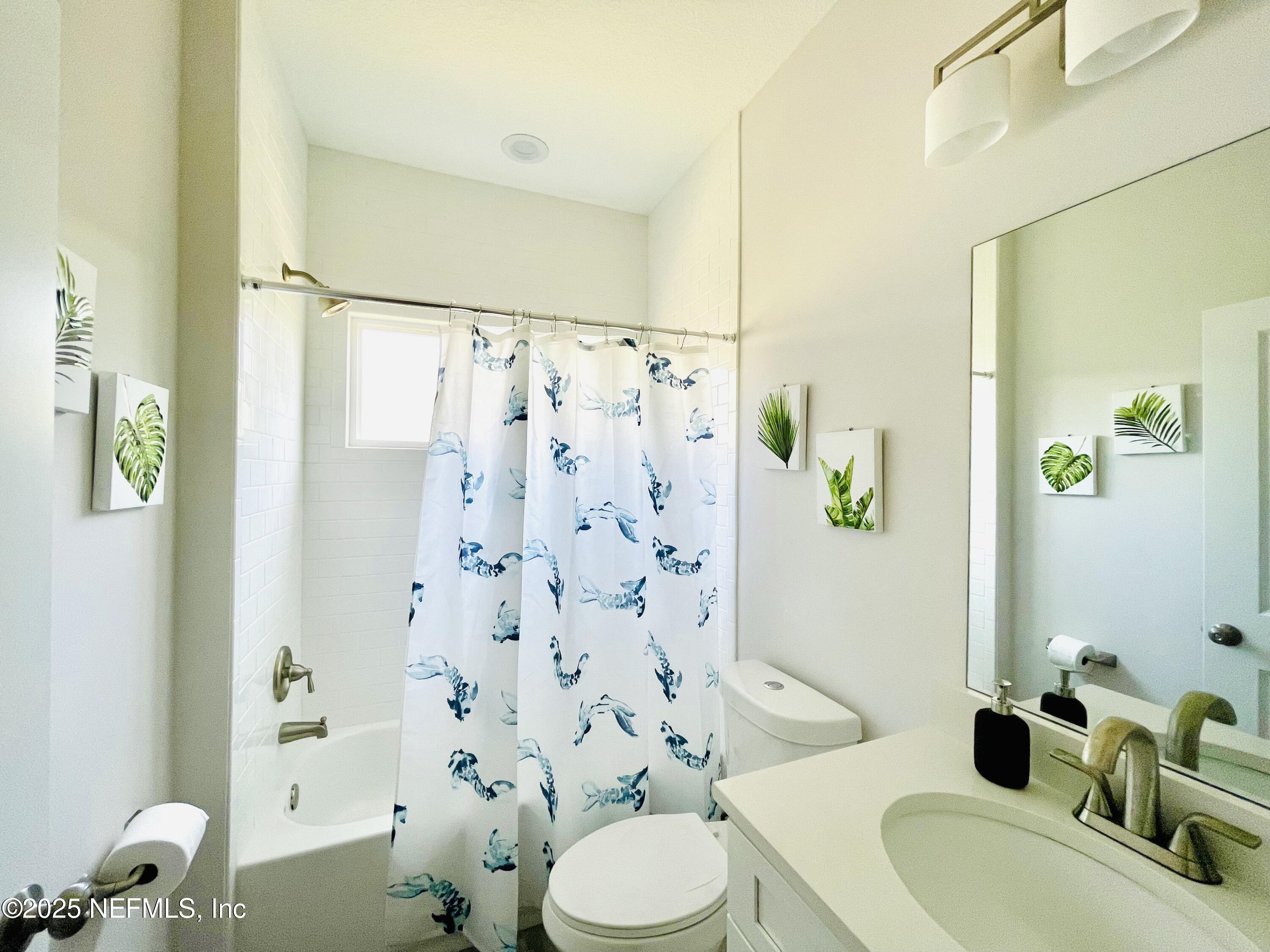 330 Trade Wind Lane St. Augustine, FL 32080 - Photo 25 of 46 a bathroom with a sink toilet and shower