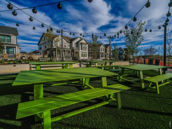 a front view of a residential apartment building with a yard