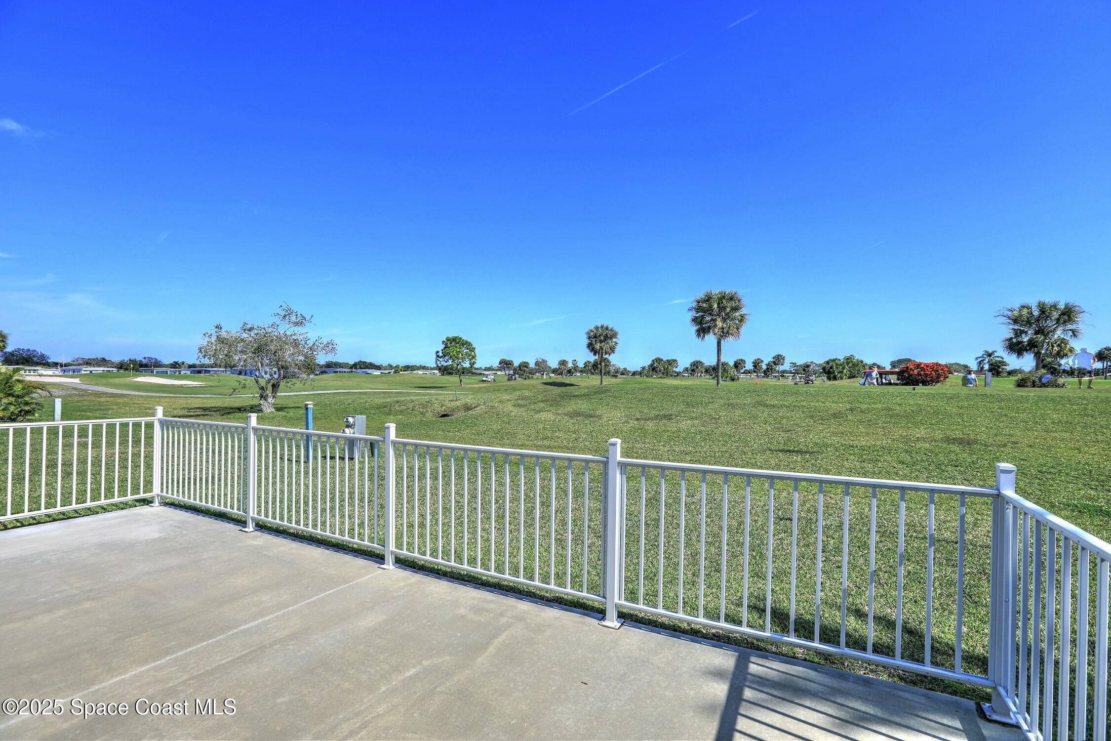 1124 Barefoot Circle Barefoot Bay, FL 32976 - Photo 23 of 79 a view of a balcony and ocean