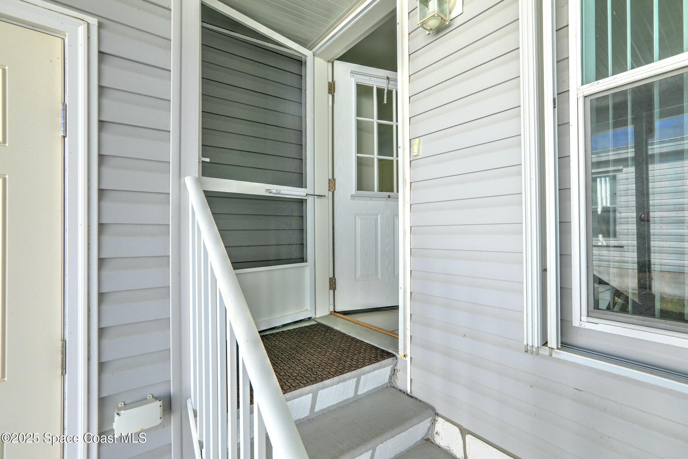 1124 Barefoot Circle Barefoot Bay, FL 32976 - Photo 30 of 79 a view of front door and porch