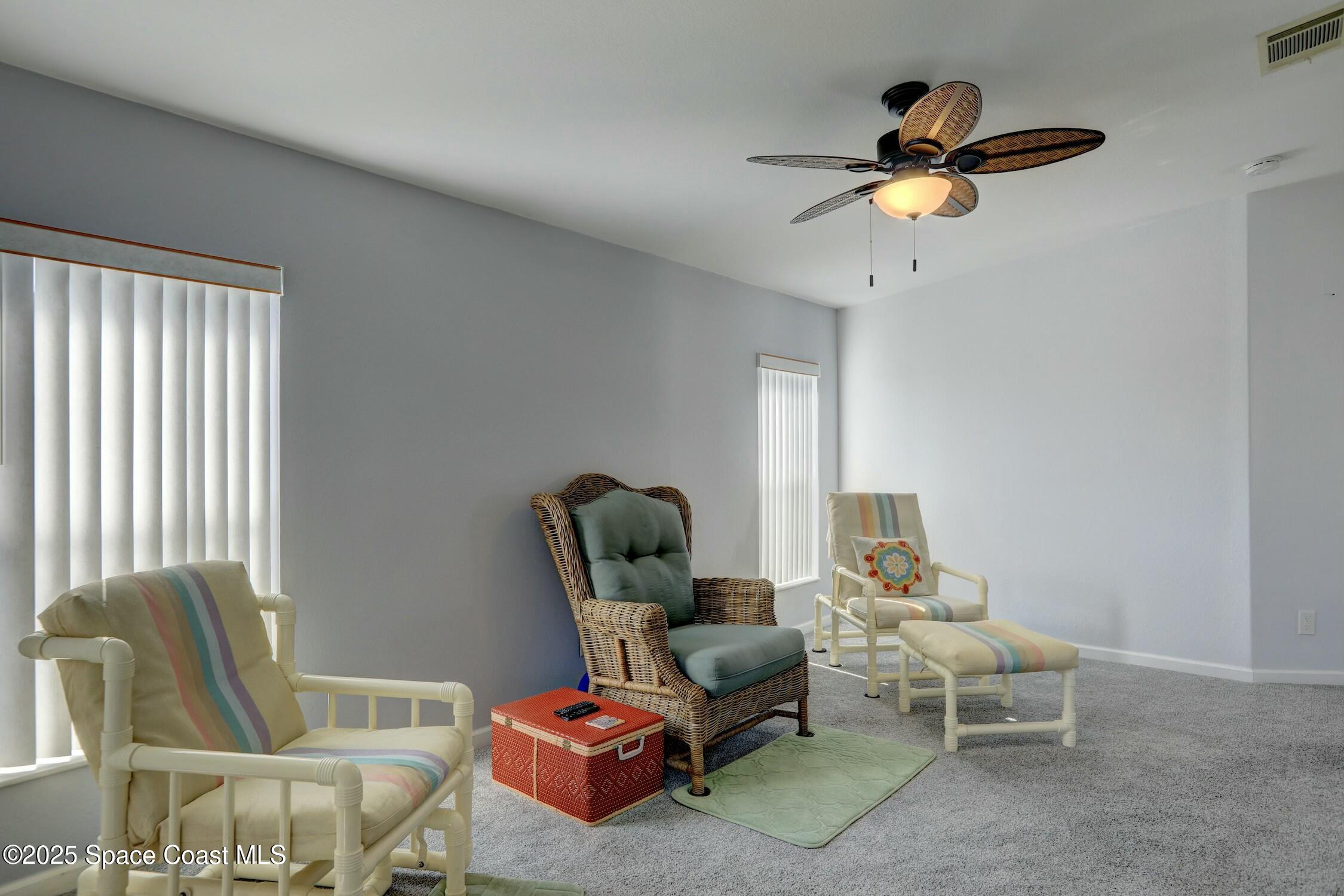 1124 Barefoot Circle Barefoot Bay, FL 32976 - Photo 31 of 79 a living room with furniture and a window