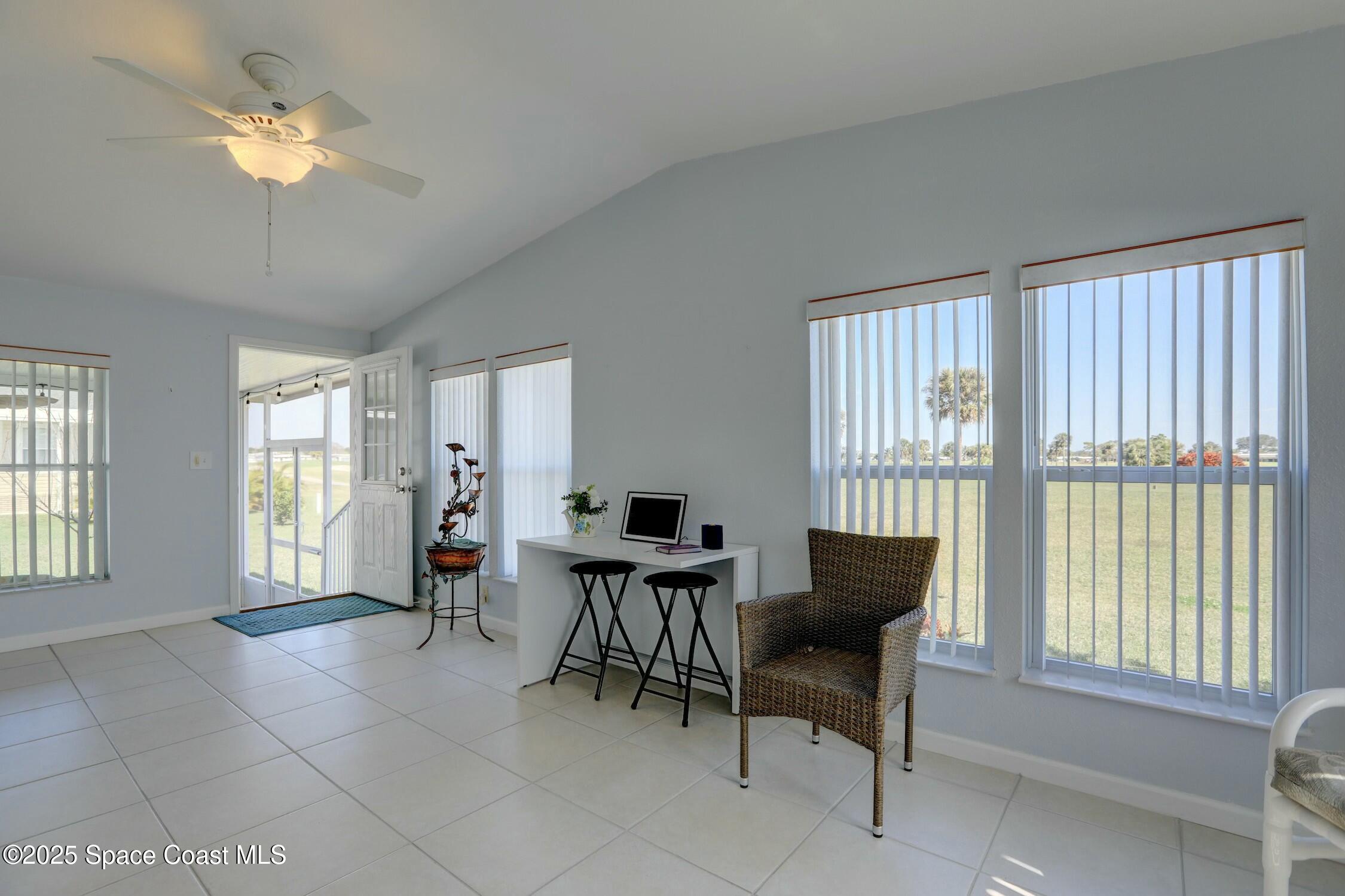 1124 Barefoot Circle Barefoot Bay, FL 32976 - Photo 40 of 79 a living room with furniture and a large window