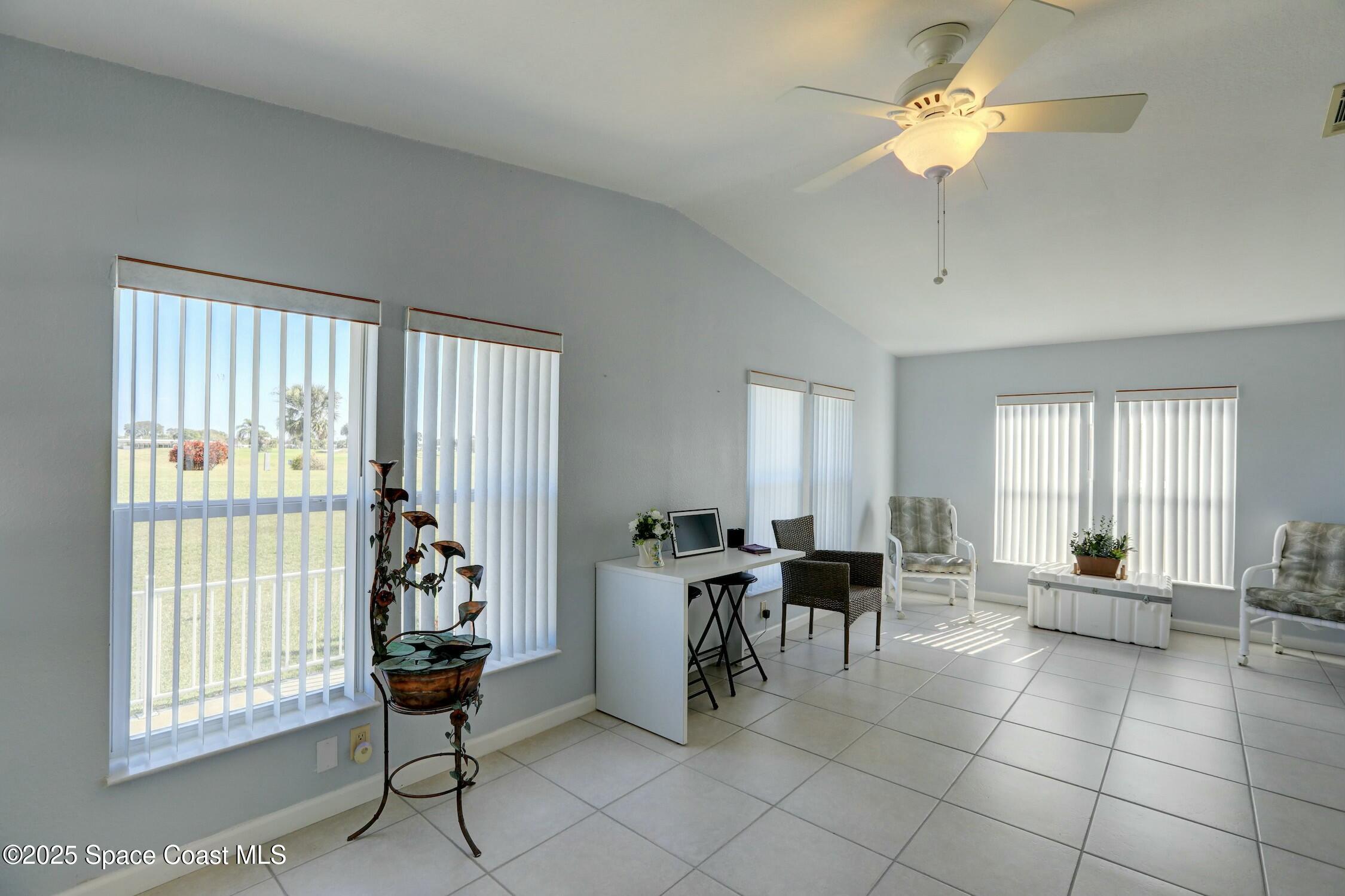 1124 Barefoot Circle Barefoot Bay, FL 32976 - Photo 44 of 79 a view of a livingroom with furniture and a window