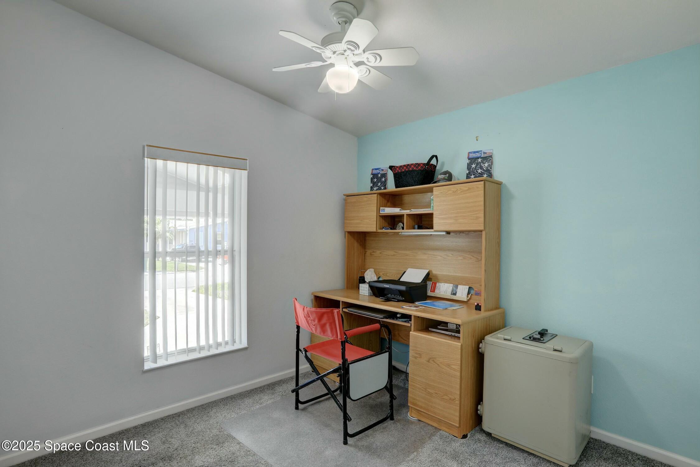 1124 Barefoot Circle Barefoot Bay, FL 32976 - Photo 59 of 79 a room with furniture and window