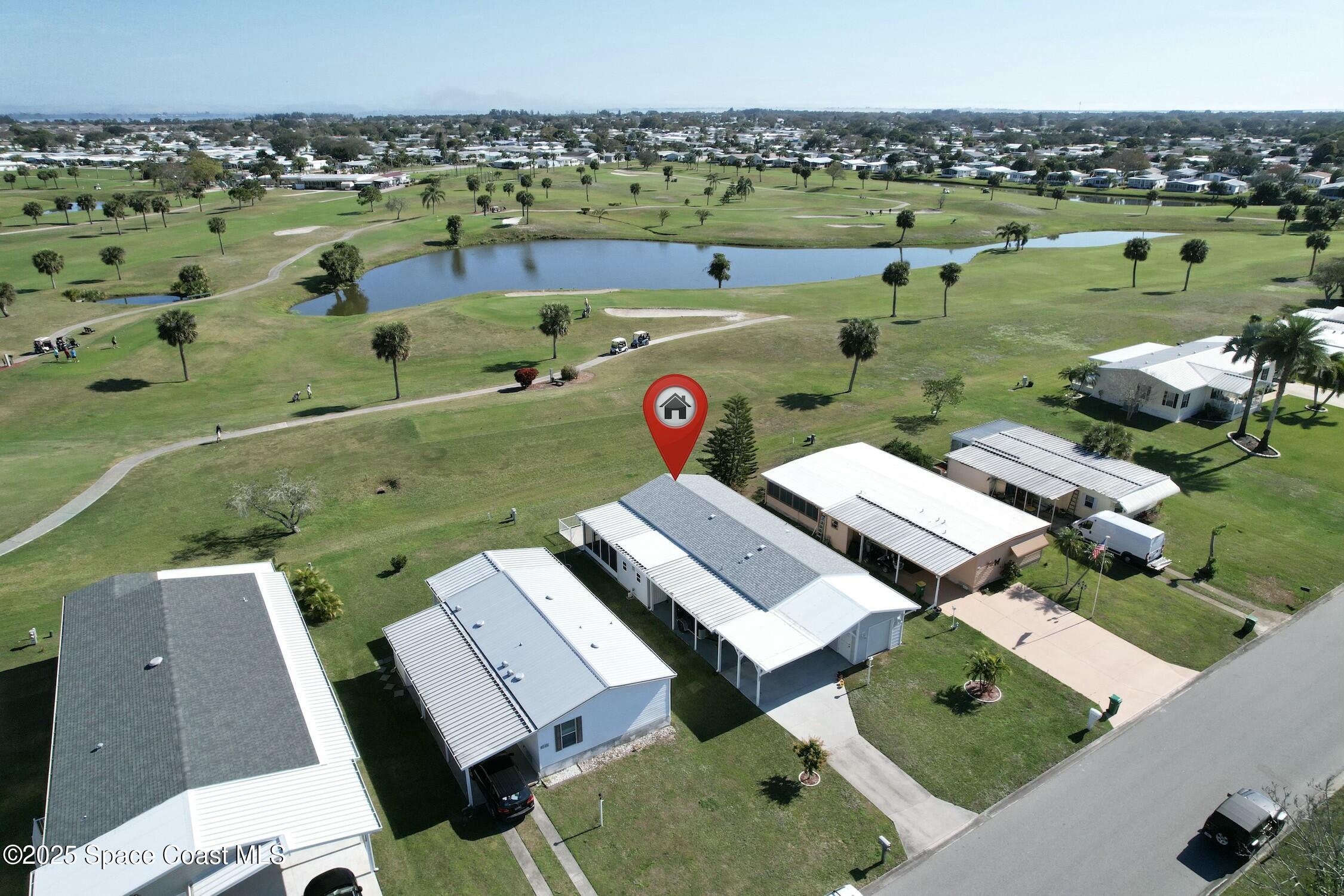 1124 Barefoot Circle Barefoot Bay, FL 32976 - Photo 9 of 79 an aerial view of a house with outdoor space