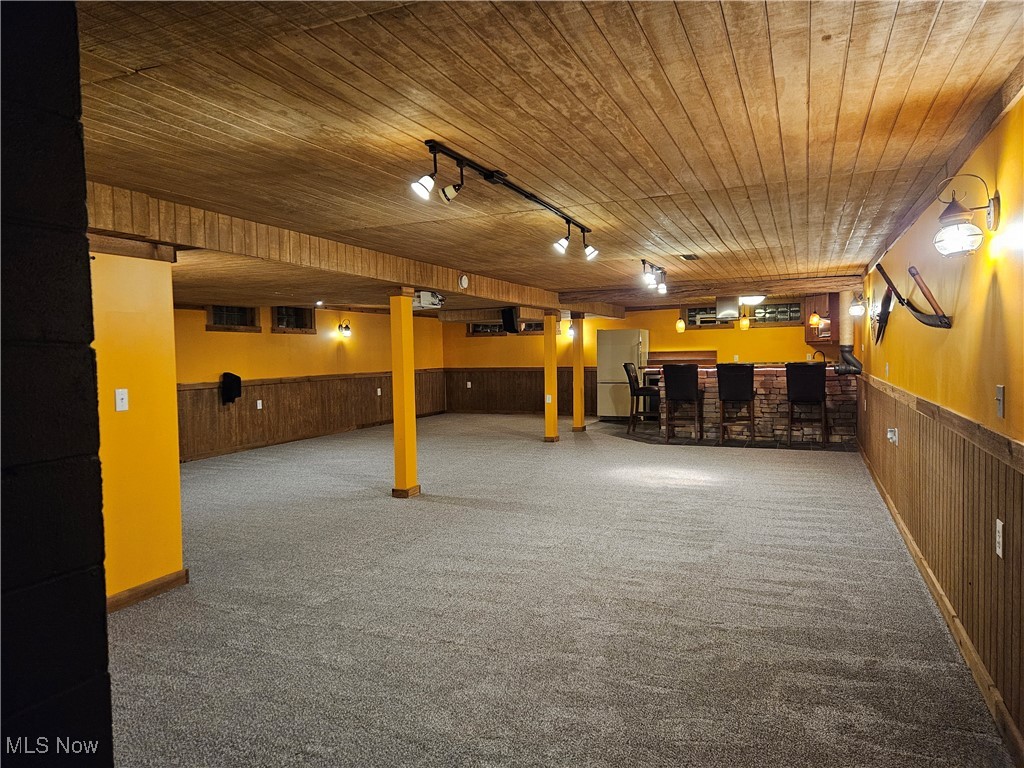 6155 Beach Road Wadsworth, OH 44281 - Photo 29 of 49 View of finished basement rec room with wood ceilings, adjustable lighting, and carpet