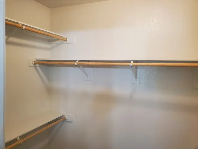 a view of a room with racks on the wall