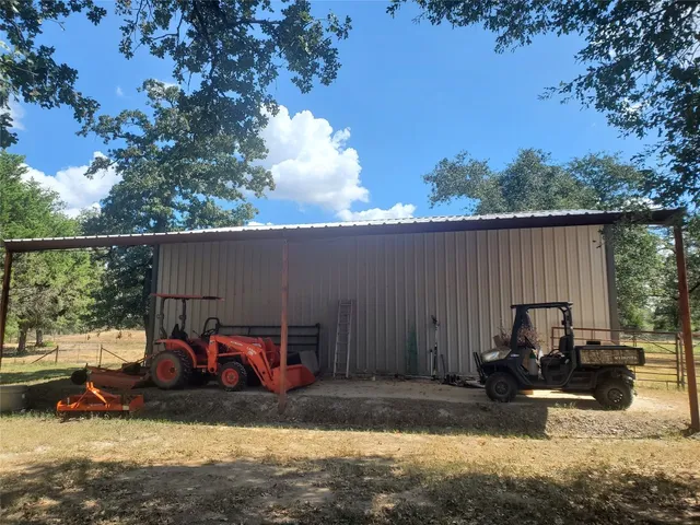 a view of a backyard with sitting area and furniture