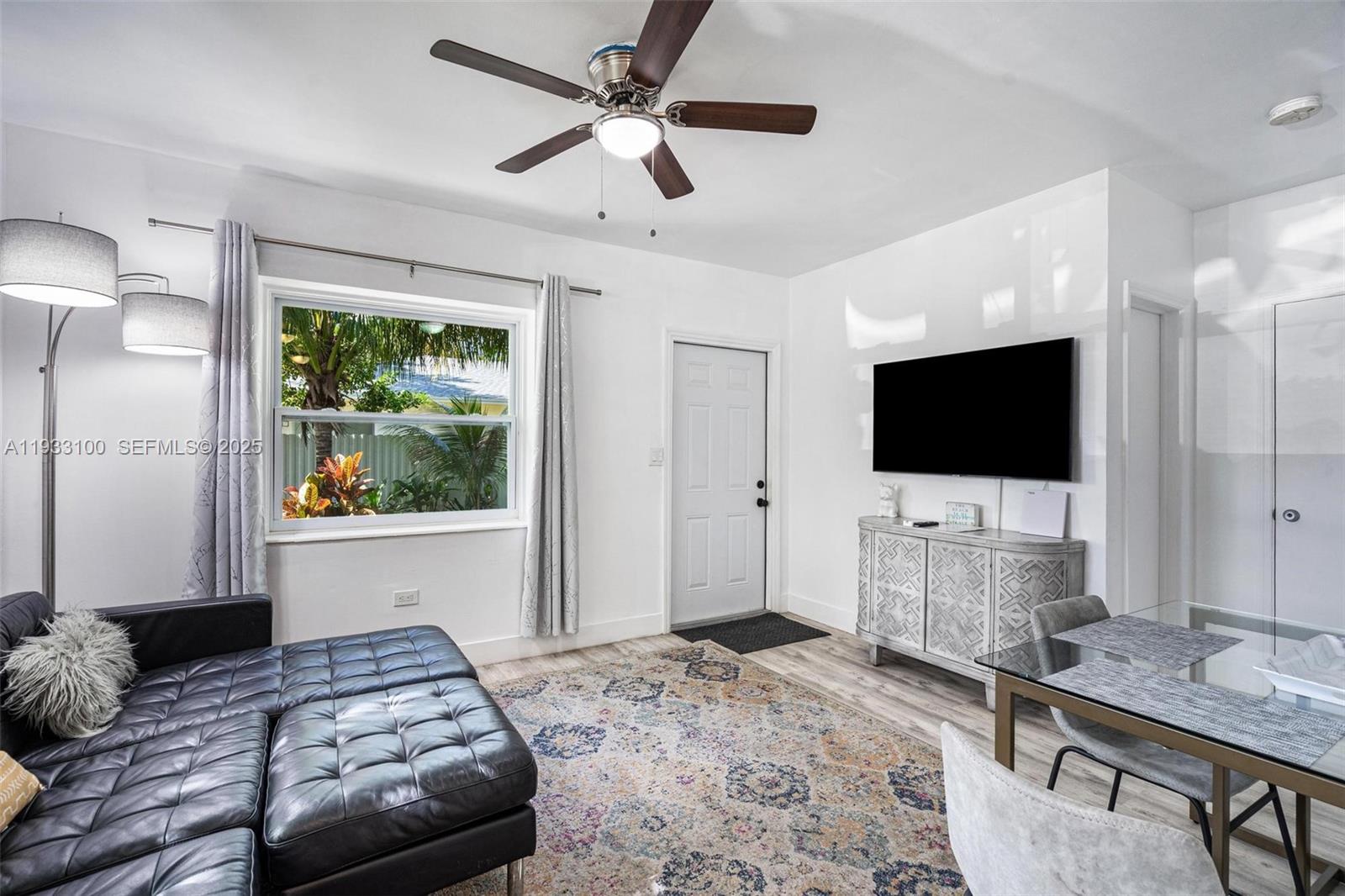 859 Northeast 90th Street Miami, FL 33138 - Photo 12 of 26 a bedroom with a bed and a flat screen tv