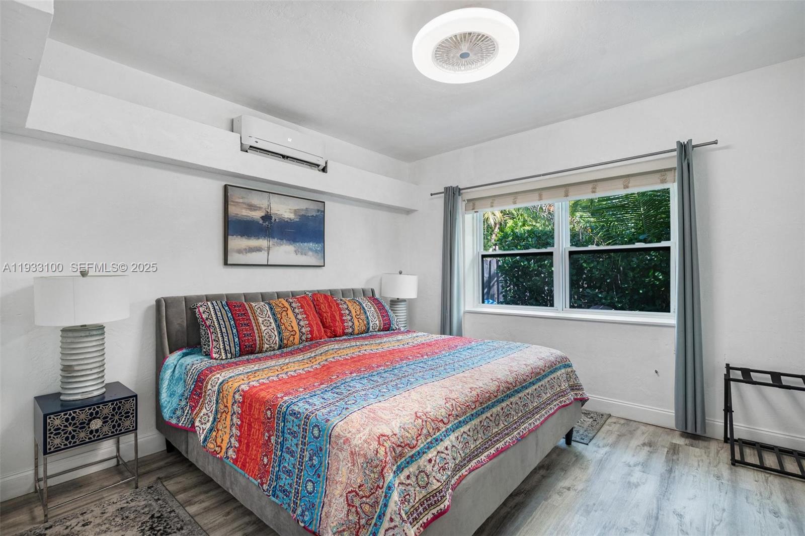 859 Northeast 90th Street Miami, FL 33138 - Photo 26 of 26 a bedroom with a large bed and a window