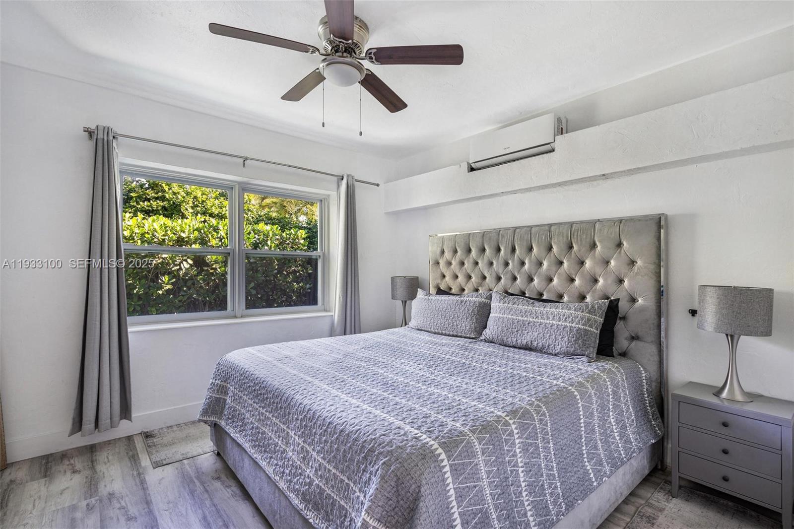 859 Northeast 90th Street Miami, FL 33138 - Photo 8 of 26 a bedroom with a large bed and a window