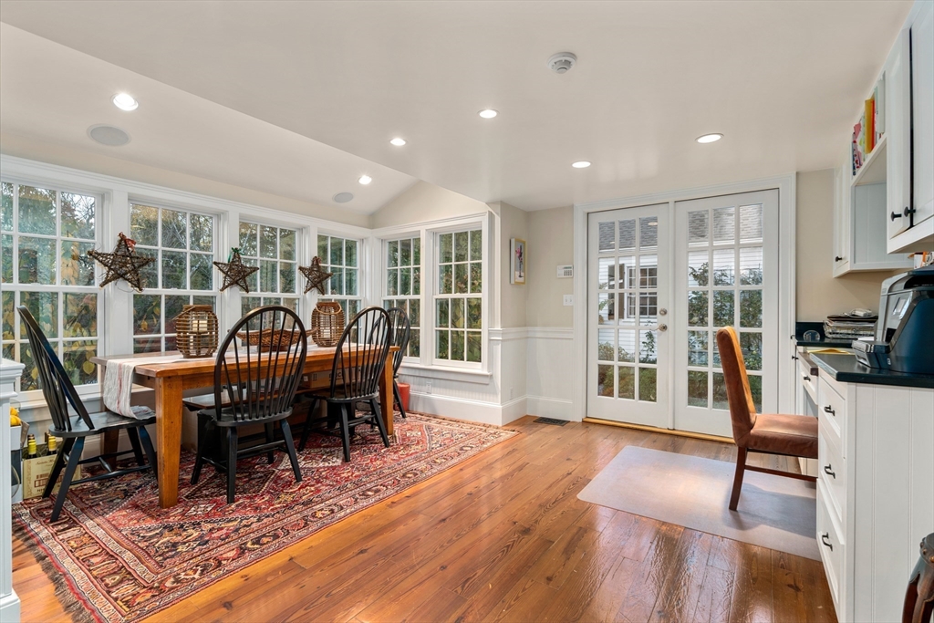 883 High Street Dedham, MA 02026 - Photo 12 of 42 a dining room with furniture a rug and wooden floor