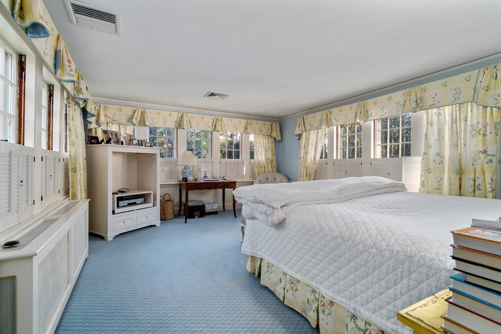 883 High Street Dedham, MA 02026 - Photo 16 of 42 a spacious bedroom with a bed and a large window